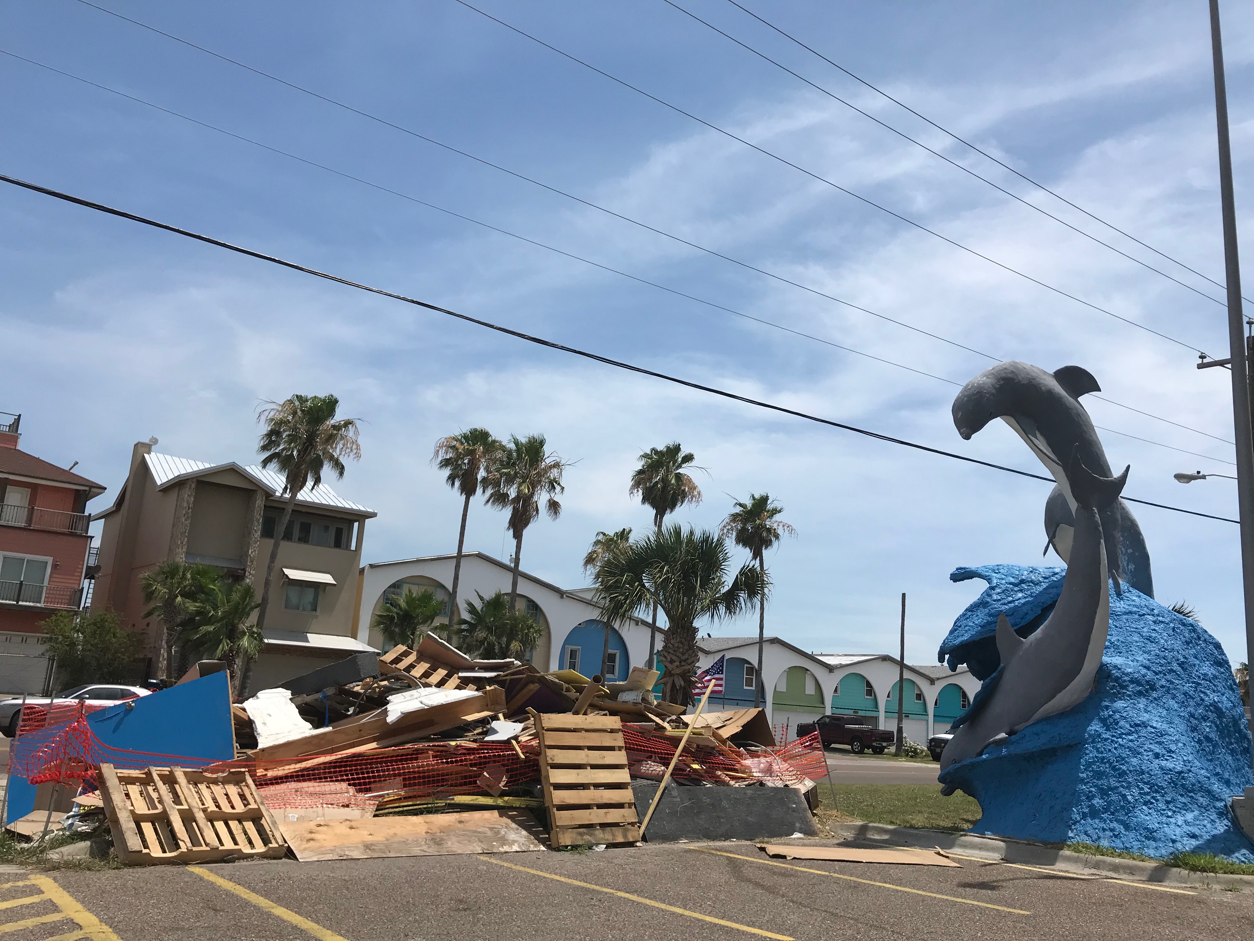 Port Aransas, Texas, is still rebuilding from Hurricane Harvey, which hit in August 2017. Piles of trash from damaged property, including this one on June 4, 2018, are a common sight. (Jamie Smith Hopkins / The Center for Public Integrity)